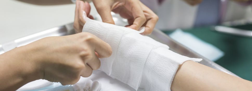 Burn Injury Lawyer - Doctor treating a patient's hand burn injury